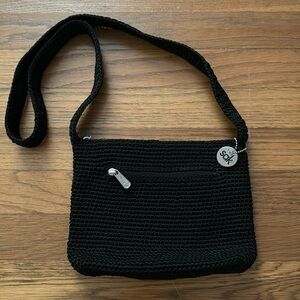 🧶The Sak black crocheted purse with inside and outside zippered pockets.